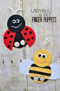 ladybug and bee finger puppets made out of construction paper on wood planks