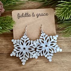 Fiddle and Grace is proud to offer affordable, lightweight super cute earrings! Need something to add to all your festive Christmas outfits? This pair of adorable, lightweight earrings is the perfect touch! They measure 1.6" wide x 1.8" tall and 1/8 inch thick.  The ones in the listing photo are made of White Marble Acrylic.  They are custom laser cut with a Classic Silver Nickel Free French Hook Ball Earwire and Antique Bronze Jump Rings. One of the reasons I love working with acylic is that ea White Winter Party Jewelry, White Snowflake Jewelry For Holidays, White Snowflake Jewelry For Festivities, Festive White Snowflake Jewelry, White Jewelry For Winter Holiday, White Snowflake Earrings For Winter, Festive White Earrings For Winter, White Holiday Earrings With Ear Wire, White Festive Earrings For Winter