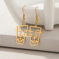 Abstract Face Gold Dangle Drop Earrings Face Statue, Face Outline, Knee High Boots Flat, Statement Fashion, Earring Trends, Abstract Face, Chic Earrings, Steel Earrings, Abstract Faces