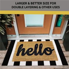 a door mat with the word hello written in black and white stripes on it next to a front door