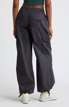 Drawstring-cinched cuffs create a baggy parachute effect in Y2K-inspired cargo pants cut from comfortable cotton and topped with an adjustable waistband. Elastic/drawstring waist Front slant pockets; back hook-and-loop flap-patch pockets; cargo hook-and-loop flap-bellows pockets Drawstring cuffs 100% cotton Machine wash, tumble dry Imported Not available for sale and shipment to Germany Relaxed Fit Cargo Jeans For Spring Outdoor, Spring Relaxed Fit Cargo Jeans For Outdoor, Spring Outdoor Relaxed Fit Cargo Jeans, Relaxed Fit Cargo Jeans With Elastic Waistband For Outdoor, Cotton Cargo Pants With Elastic Waistband For Outdoor Activities, Cotton Cargo Pants With Elastic Waistband For Outdoor, Wide Leg Cotton Cargo Jeans For Outdoor, Relaxed Fit Cargo Jeans For Outdoor, Baggy Cotton Cargo Jeans For Outdoor