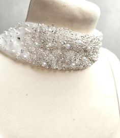 Custom order - the Jasmine bridal scarf / cape is glamorous and dazzling as well as elegant and classy. You can specify the range and tone of beading or I can advise what would work best with your wedding outfit. I use a mix of vintage and modern beads and pearls. The front of the bridal scarf is a hand-embroidered beaded choker with optional clasp or chain and the back falls like a veil, with scattered beads / pearls of your preference. The main fabric is tulle or illusion netting in a range of Scarf With Pearls, Bridal Scarf, Wedding Shawls, Jasmine Bridal, Cape Scarf, Bridal Choker, Winter Bride, Wedding Shawl, Vintage Beads