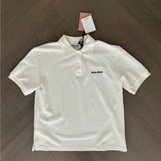 Miu Miu Logo Embroidered Cotton Polo Shirt White Size Xs Brand New With Tags. Miu Miu White Shirt, Classic Miu Miu Cotton Tops, Miu Miu Cotton Collared Tops, Miu Miu Collared Cotton Tops, Classic Cotton Miu Miu Tops, Miu Miu Polo Shirt, Casual Miu Miu Short Sleeve Tops, Casual Collared Tops By Miu Miu, Casual Miu Miu Tops For Spring