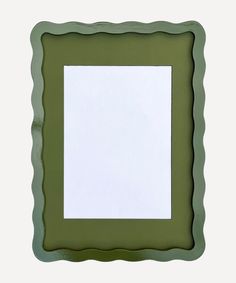 a green frame with an empty white paper in the middle and a small square at the bottom