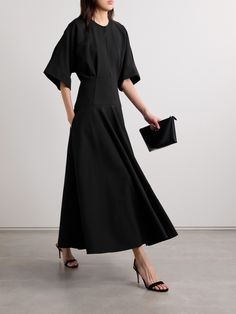 Brandon Maxwell's 'The Darcy' midi dress is modest and elegant, so you'll feel confident wearing it to a number of occasions. Cut from black cotton, it has wide sleeves and a smooth, fitted panel at the hips before falling to a full skirt. Slim cutouts along the neck and back reveal just a glimpse of skin. Modern Black Maxi Dress For Work, Modern Formal Maxi Dress, Luxury Maxi Dress For Workwear, Modern Black Midi Dress For Formal Occasions, Luxury Black Midi Evening Dress, Luxury Black Midi Dress, Modern Black Midi Dress For Evening, Luxury Black Midi Dress For Formal Occasions, Luxury Black Midi Dress For Formal Events