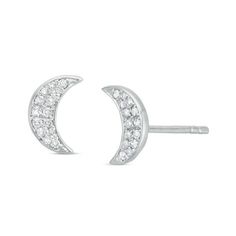 There will be stars in her eyes when you present these shimmering diamond moon stud earrings. Crafted in sterling silver, each earring - one a waxing crescent and the other a waning crescent - sparkles with round diamonds. Radiant with 1/8 ct. t.w. of diamonds and a bright polished shine, these post earrings secure comfortably with friction backs. Moon Shaped Sterling Silver Jewelry With Diamond Accents, Celestial White Gold Sterling Silver Earrings, White Gold Crescent Sterling Silver Earrings, White Gold Sterling Silver Crescent Earrings, Sterling Silver Crescent Jewelry With Diamond Accents, Sterling Silver Moon-shaped Earrings For Anniversary, Sterling Silver Moon Earrings For Anniversary, Silver Half Moon Diamond Jewelry, Celestial Diamond Silver Earrings