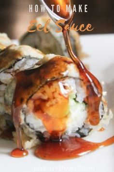 a plate with some sushi on it and sauce drizzled over the top