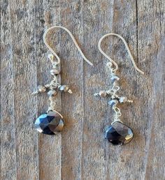 This product is made of metal alloy (silver and copper and other metal alloys) with high- quality plating (It will last for a long time without tarnish). Handmade with love in Sausalito, California. | A Blonde and Her Bag Black Spinel Drop Earrings with Pyrite Accent Beads. Silver dangle earrings with pyrite accent beads and a black spinel drop. Size: 8" Length Hypoallergenic. | 1-800-Flowers Gifts Delivery Black Spinel Drop Earrings W/ Pyrite Accent Beads Adjustable Faceted Silver Earrings, Artisan Silver Earrings With Round Beads, Artisan Silver Earrings With Silver Beads, Silver Bead Artisan Earrings, Artisan Silver Faceted Jewelry, Artisan Faceted Silver Jewelry, Sausalito California, Flowers Gifts, Silver Dangle Earrings