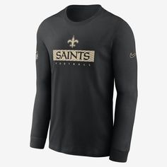 Featuring bold New Orleans Saints graphics across the chest, this Sideline Team Issue T-Shirt combines lightweight polyester with sweat-wicking technology to help keep you dry and comfortable. Black Crew Neck Top With Team Logo, Black Long Sleeve Fan Gear T-shirt, Nike Black Tops With Team Logo, Black Nike Top With Team Logo, Nike Crew Neck Graphic Print Tops, Black Nike Fan Apparel Tops, Nike Black Fan Apparel Tops, Nike Crew Top With Letter Print, Nike Black Tops Fan Apparel