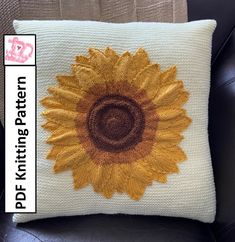 a pillow with a sunflower embroidered on it