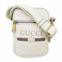 The Gucci Logo Print Leather Crossbody Bag In White Is Made In Italy From Quality Leather. This Bag Is White Leather With Gucci Vintage Logo And Green/Red Web Stripe At Front. Gucci Logo Print Leather Crossbody Bag In White 100% Calfskin Leather Gold-Toned Hardware Front Zipper Pocket Adjustable Leather Strap Top Zipper Closure Cotton Linen Lining One Compartment Inside Unisex W 13 Cm H 18 Cm D 5cmw 4.72" H 7.08" D 1.96") Strap Drop: 60cm (23.6") Shoulder Strap: 72-136 Cm28.3"-53.5" Product Numb Gucci Snake Bag, Gucci Soho Disco Bag, Gg Marmont Bag, Snake Bag, Soho Disco Bag, Gucci Crossbody Bag, Embossed Bag, Red Web, Vintage Crossbody Bag