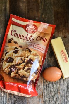 a bag of chocolate chip cookies next to an egg