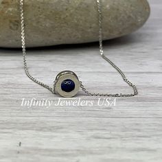 "The pendant pictured is lab created blue sapphire #5871 -Approximate total carat weight: approx. .80ctw diamond equivalent -Center Stone Size: 6mm - approx. .80ct diamond equivalent -Center Stone Shape: round -Gem Type: lab created sapphire -Stone Clarity: VS2 -Stone Color: Blue -Moh's Scale: 9 hardness -Metal Type and Purity: 14k white gold -Setting: bezel set floating necklace -Chain: 18\" delicate 14k gold chain / heavier option with lobster claw available (use dropdown to select) -Country o Sapphire Jewelry With Vvs Clarity In Round Shape, White Gold Necklace With Birthstone And Lab-created Sapphire, Round Sapphire Jewelry With Vvs Clarity, White Gold Necklace With Lab-created Sapphire Birthstone, White Gold Sapphire Jewelry With Birthstone, Yellow Gold Lab-created Sapphire Jewelry Gift, Sapphire Round Pendant For Anniversary, Sapphire Round Pendant Jewelry For Anniversary, Sapphire Jewelry Stamped 14k For Gift