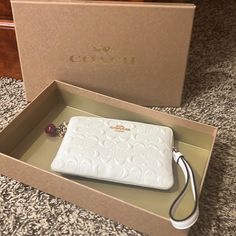 Never Used Has Tags And Originally Boxing White Rectangular Clutch, White Rectangular Clutch For Everyday Use, White Rectangular Clutch As Gift, Rectangular White Clutch As Gift, Coach Rectangular Wristlet For Gift, Coach Rectangular Wristlet As Gift, Coach Rectangular Wristlet, Rectangular Coach Wristlet As Gift, Beige Clutch With Wrist Strap For Gift