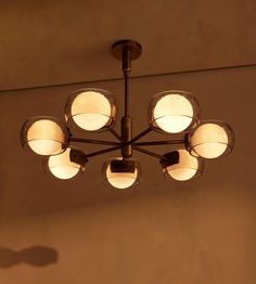 a chandelier hanging from the ceiling in a room