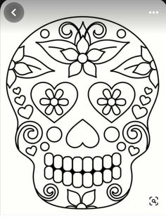 a sugar skull with flowers on it