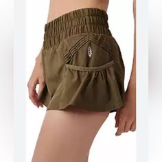 Nwot Free People Movement High Rise Get Your Flirt On Shorts So Flirty And Fun Shorts To Spice Up Your Workout Attire, Featured In A Flowy Style With A High-Rise, Smocked Waistband And Side Pockets. Pull-On Style Elastic Waistband Side Pleated Accents Care + Content Machine Wash Cold Import 100% Polyester Color: Dark Olive Green Size: X-Small Make An Offer Casual Yoga Skort Short Length, Stretch Yoga Shorts With Pockets, Summer Yoga Shorts Hip-length, Yoga Bottoms With Pockets, Short Yoga Bottoms With Pockets, Yoga Shorts With Waistband For Summer, Summer Workout Skort With Pockets, Hip-length Cotton Bottoms With Built-in Shorts, Stretch Shorts With Hip Pockets For Summer