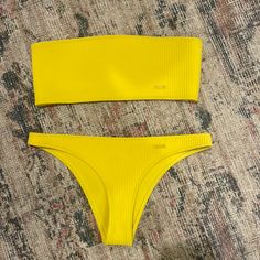 Super Cute Yellow Triangl Bikini In Brand New Condition Yellow Seamless Swimwear For Spring, Yellow Strapless Swimwear For Poolside, Yellow Seamless Swimwear For Beach Season, Yellow Bandeau Swimwear For Summer, Yellow Triangle Top Swimwear With Padded Cups, Yellow Seamless Swimwear For Poolside, Yellow Fitted Triangle Top Swimwear, Yellow Seamless Stretch Swimwear, Yellow Strapless Beachwear Swimwear