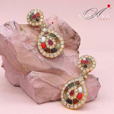 Navratna Stone Earring |Semi Precious Navaratna Earring | Moissanite Polki Earring | Indian Wedding Jewelry | Stud | Earring Material: Silver Gemstone: Moissanite Polki, Semi Precious Navratna Stones  Stone colour:  Uncut Polki Primary colour: Gold Size-Length: 60mm Width: 30mm Closure: Screw back and Omega Clips Silver Intricate, hand-crafted, Pure Silver Polki Earrings, studded with high-quality Semi Precious Navratna Stones, Earring comes with a screw back and clips, made in 92.5 silver with Fusion Style Gemstone Chandelier Earrings For Wedding, Wedding Gemstone Diamond Drop Earrings, Wedding Diamond Drop Earrings With Gemstones, Wedding Gemstone Drop Diamond Earrings, Elegant Multicolor Kundan Bridal Earrings, Teardrop Diamond Earrings With Gemstone For Weddings, Festive Gemstone Earrings For Wedding, Wedding Gemstone Danglers, Elegant Multicolor Bridal Earrings For Celebration