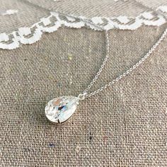 "Heatherly Designs simple pendant necklace made using a genuine teardrop Swarovski® crystal in colorless 'Crystal'. Necklace chain, setting and findings are plated brass. ●Nickel free ●Length (adjustable): 17\" - 19\" or 43.18 - 48.26cm ●Pendant Size: 14x10mm ●Swarovski® crystal color(s): Crystal ●Matching Earrings: http://etsy.me/1KcIUID ●Matching Bracelet: http://etsy.me/2a6MZi9 ●Arrives in our signature Heatherly gift box. Handmade with ❤ by Heather ● ● ● ● ● ● ● ● ● ● ● ● ● ● ● ● ● ● ● ● ● ● White Crystal Teardrop Drop Necklace, Teardrop Crystal Drop Necklace For Anniversary, Teardrop Crystal Necklace For Wedding, Crystal Teardrop Drop Necklace For Anniversary, Crystal Teardrop Pendant Necklace For Anniversary, Teardrop Crystal Necklace For Gift, Crystal Necklace With Teardrop Pendant For Gift, Crystal Teardrop Necklace For Anniversary, Teardrop Crystal Necklace Gift