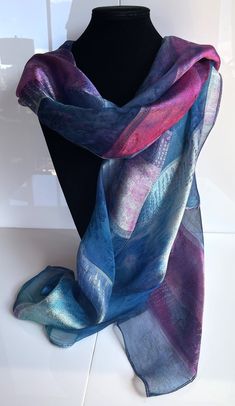 This hand painted silk scarf is made from luxurious silk jacquard. With alternating panels of silk organza and woven jacquard, this large oblong scarf has a striking sheen and is suitable for evening or day wear. Painted by Acacia Silks Tasmania, this unique scarf is impossible to replicate. The dyes used to paint this scarf have been fixed and the easy-care instructions are supplied with the item. Silk Shawl Scarf For Party, Party Silk Scarf With Satin Finish, Unique Scarf, Pure Silk Scarf, Silk Scarf Painting, Hand Painted Silk Scarf, Painted Silk, Hand Painted Silk, Silk Organza