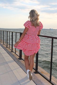 Lizzy is our newest LOVE! Look at this dress, it screams all things Summer, and Americana! Unleash your summer adventures in this trendy and playful MINI DRESS! With a charming SQUARE NECK and flattering SMOCKED BODICE, this dress will have you looking effortlessly stylish. The TIERED design adds a fun and unique touch to this red and white gingham dress. Model is 5'7 wearing small- runs true to size The red gingham • Fabric: - SELF: 97% POLYESTER 3% SPANDEX - LINING : 100% POLYESTER Gingham Smock Dress, 80's Clothes, Gingham Mini Dress, Red And White Gingham, Gingham Fashion, 80s Outfit, Gingham Fabric, Red Gingham, Activewear Sets