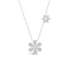 Bring the beauty of springtime to your everyday looks with this dainty diamond daisy necklace. Set along an elegant cable chain, the flowers in this piece give off just the right amount of sparkle. -14K gold weighing 3.48 grams -144 round diamonds totaling 0.34 carats -2 round diamonds totaling .05 carats Available in rose, yellow, & white gold. Please allow 4-6 weeks for delivery if item is not in stock. Item no. N10322 Diamond Signet Ring, Daisy Pendant, Elephant Pendant Necklace, Diamond Heart Pendant Necklace, Rainbow Gemstones, Daisy Necklace, Disc Earrings, Elephant Pendant, Bezel Set Diamond