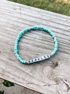 The perfect turquoise solid bracelet for any outfit! Paired with white block letters and gold accents. All bracelets are made at an average wrist size. They're stretchy. However, if you need a smaller/larger size please request that. IMPORTANT:  *The colored beads I use are glass/painted. Due to that characteristic there is normal wear and tear with the color fading if they become wet or come into any chemicals/lotions/perfumes/body oil* Casual Turquoise Beaded Bracelets With Letter Beads, Casual Turquoise Beaded Bracelet With Letter Beads, Casual Turquoise Bracelets With Letter Beads, Trendy Turquoise Stretch Bracelet With Letter Beads, Personalized Casual Turquoise Jewelry, Casual Personalized Turquoise Jewelry, Personalized Casual Turquoise Beaded Bracelets, Personalized Turquoise Casual Beaded Bracelet, Casual Personalized Turquoise Beaded Bracelets