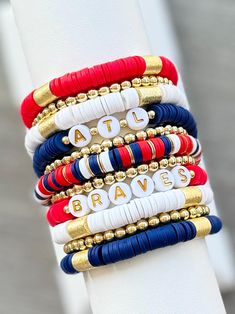 several bracelets are stacked on top of each other