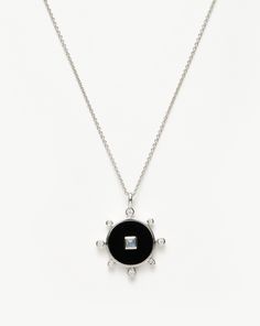 On a delicate chain, this round amulet pendant features inset cubic zirconia around its edge. The square central rainbow moonstone features within a bold black onyx stone inlay – the protection stone – to create a contrast of textures. Finished in a matte medium polish for a vintage feel. Let it shine solo or layer with a chain choker for a layered look.Metal: Rhodium Plated on Recycled Sterling Silver Gemstones: Black Onyx, Rainbow Moonstone and White Cubic Zirconia Dimensions: 20mm x 20mm Weight: 6.4gProduct code: VIN-S-N2-CZ-RBM-BX Double Chain Bracelet, Matte Medium, Let It Shine, Black Onyx Stone, Star Earrings Stud, Stone Inlay, Delicate Chain, Pearl Pendant Necklace, Onyx Stone