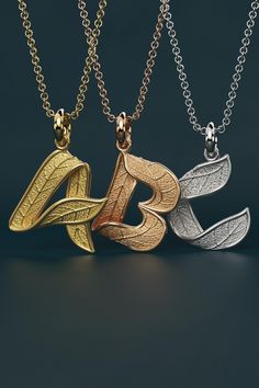 Discover our exquisite initials gold pendant necklace, a nature-inspired piece featuring a stunning leaf texture. Handcrafted in Italy, this elegant necklace is available in both 14k and 18k gold, ensuring a luxurious finish. Personalize your style with your initials beautifully captured in this unique design. Perfect for nature lovers and those who appreciate fine craftsmanship, this necklace makes a thoughtful gift for any occasion. Elevate your jewelry collection with this timeless accessory that celebrates individuality and nature's beauty. Available in 14k or 18k gold: Choose from luxurious rose, white, or yellow gold tones. Dimensions: Each letter is approximately 2 cm, a perfect size for daily wear. Customizable: Available with or without a 45 cm gold rolo chain, allowing you to cre Gold Initial Pendant, Sideways Initial Necklace, Gold Letter Necklace, Bar Necklace Personalized, Leaf Texture, Couple Necklaces, Elegant Pendant, Elegant Necklace, Black Gift Boxes