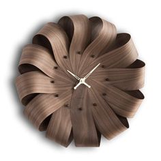 a clock made out of wood on a white background