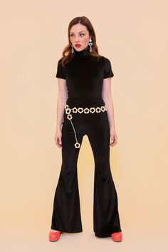 Jagger Jumpsuit in Black – Miracle Eye Fitted Black Flares For Evening, Black Full Length Flares For Party, Black Fitted Flares For Night Out, Black Fitted Flares For Party, Glamorous Fitted Wide Leg Jumpsuits And Rompers, Vintage Flare Pants For Party, 70s Inspired Fitted Party Bottoms, Chic Fitted Flares For Night Out, Retro Flare Pants For Parties