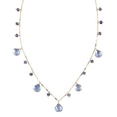 A stunning piece of everyday elegance, the Briolette Drop Necklace is another bestseller. The decadent drops of stationary gemstones look great with a casual outfit but can easily transition to a formal occasion. Handcrafted in 14k gold-fill or sterling silver Available in 18" or 32" length with a lobster claw clasp Shown in green amethyst, garnet, blue topaz, white topaz. Also available with precious stones. View our Gem Glossary Briolette Necklace, Gold Drop Necklace, Everyday Elegance, Pink Topaz, Green Amethyst, Drop Necklace, Precious Gemstones, White Topaz, Formal Occasion