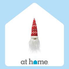 a red and white gnome's hat on top of a blue background with the at home logo below it