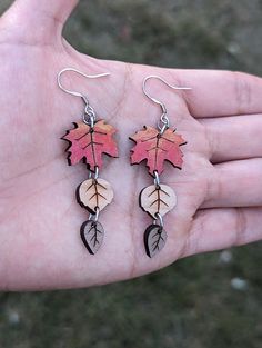 Introducing these stunning Leaves Wooden Earrings, perfect for adding a touch of nature to any outfit. Crafted from high-quality wood, these earrings are durable and lightweight, making them comfortable to wear all day long.  Made in three different designs: Leaves wooden Earrings Style #1 made with mahogany, cherry and walnut wood - Length 1.5" Drop length with ear wire hooks 2.25" Leaves wooden Earrings Style #2 made with mahogany, cherry and walnut wood - Length 1.5" Drop length with ear wire Nature-inspired Hypoallergenic Dangle Earrings, Hypoallergenic Leaf-shaped Nature-inspired Jewelry, Everyday Leaf-shaped Jewelry With Matching Earrings, Nature-inspired Hypoallergenic Leaf Earrings, Nature-inspired Leaf Earrings For Everyday, Nature-inspired Leaf Jewelry For Everyday, Everyday Nature-inspired Leaf Jewelry, Wooden Earrings, Wood Earrings