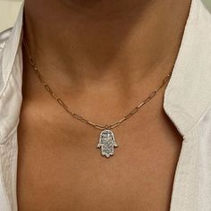 This Majestic Hamsa Pendant Necklace Features Prong Set Baguette Cut Diamonds With An Outline Of Round Brilliant Cut Diamonds. Total Diamond Weight: 0.59 Carat. The Pendant Is Crafted In 14k White Gold And The Paperclip Link Chain Comes In 14k Yellow Gold. Diamond Color G-H And Si Clarity. Pendant Size: 17x13mm. Chain Length: 16.5 Inches. Comes With A Presentable Gift Box. Id: 02124 14k Gold Jewelry With Baguette Diamonds In Diamond White, 14k White Gold Necklace With Baguette Cut, 14k Gold Jewelry With Silver Baguette Diamonds, 14k Gold Silver Jewelry With Baguette Diamonds, 14k Gold Fine Jewelry Chain Necklace With Diamond Accents, 14k Gold Chain Necklace With Diamond Accents, Dainty Sterling Silver Jewelry With Baguette Diamonds, Dainty White Baguette Diamond Jewelry, Dainty White Jewelry With Baguette Diamonds