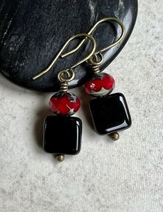 "black red earrings   small dangle earrings   square czech glass earrings Faceted red Czech glass beads have a gray Picasso coating on their tops and bottoms. Each one sits on a small, shiny black Czech glass square bead. Small hook ear wires are antiqued brass. Length of earrings from top of ear wires is 1 1/4\". Black squares measure 9x9mm. You can enter my shop here: gypsydangles.etsy.com" Black Rectangular Earrings For Gift, Rectangular Black Earrings For Gifts, Black Czech Glass Jewelry With Ear Wire, Elegant Black Czech Glass Earrings, Small Dangle Earrings, Earrings Square, Small Boho, Square Bead, Red Earrings