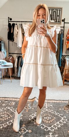 Indulge in a taste of luxury with our Poplin Tiered Dress. Crafted from 100% cotton, this structured dress exudes a rich and sophisticated look, while remaining playful with its ruffles and bows. Plus, it has pockets! This white dress boasts contrasting taupe trim and side ties for an exclusive touch. Complete your wardrobe with this ultimate girly dress. True to size. I’m shown wearing a small. Taupe Trim, Nashville Outfit, Church Outfit, Structured Dress, Nashville Outfits, Girly Dresses, Sophisticated Look, Grad Dresses, Tiered Dress