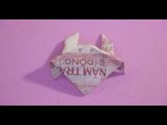 an origami fish made out of money on a pink background with the words do not buy