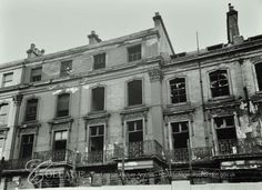 an old building with many windows and balconies