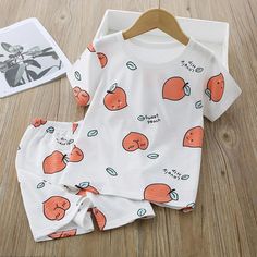 Grow Boy Peach Print Pajamas Sets - PrettyKid Orange Cotton Pajama Party Set, Playful Orange Sleepwear For Sleepovers, Orange Cotton Sleepwear For Summer, Orange Summer Sleepwear For Sleepover, Orange Cotton Summer Sleepwear, Printed White Sleepover Sets, White Cartoon Print Sleepwear Set, White Printed Sleepover Sets, Family Matching Pajama Sets For Summer