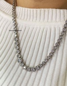 Bezel Set Moissanite Tennis Necklace, Round Brilliant Cut Diamond Wedding Necklace, 10k White Gold Bridal Necklace, Anniversary Gift For Her Detail about stones Moissanite & Simulated Stone: ----------------------------- ➠Stone Shape : Round Cut ➠Stone Size : 4 mm, 3.50 mm ➠Weight: 26.3 TCW ➠Color: Colorless ➠Cut: Excellent ➠Clarity: VVS ✍This Listing's images are only for Imagin about this item. This is all our photography. If you place the order then the same item we can make it. ✍ This displayed all products are made with a highly polished shiny gold finished Jewelry. As well as I will provide you to select the variant of white gold 10K/14K/18k foiling selection is on up to you✱ ✱ Custom Made✱ ----------------- ➠ Metal Variants: 925 Sterling Silver / 10k / 14k / 18k / 950 Platinum ➠ Met Diamond Wedding Necklace, Diamond Necklace Wedding, Gold Bridal Necklace, Gold Engraving, Tennis Necklace, Wedding Jewellery Necklace, Platinum Metal, Anniversary Gift For Her, Bridal Necklace