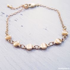 Beautiful dainty bracelet, this tiny coin bracelet is made with a dainty, yet durable, 18k gold plated coins and chain and it's perfect for layering with other chain bracelets or bangle bracelets (sold separately). ✤Small coin chain - 18K high-quality Gold plated Total length: 6//6.5//7//7.5//8 inches with an extension of 1.5 inches ✤If you need a different size please send me a message. Feel free to contact me for details & options. ♥All items are packed in an elegant jewelry box and ready Elegant Yellow Gold Nickel-free Charm Bracelet, Gold Nickel-free Chain Bracelet For Everyday, Elegant Gold Nickel-free Chain Bracelet, Elegant Nickel-free Brass Chain Bracelet, Elegant Yellow Gold Nickel-free Bracelets, Dainty Adjustable Gold Chain Charm Bracelet, Minimalist Brass Chain Bracelet For Gift, Dainty Gold Plated Charm Bracelet With Delicate Chain, Minimalist Brass Chain Bracelet Gift