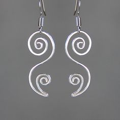 "This unique floral dangling earrings are handmade either from sterling silver. The principles of beauty and grace realized in serpentine lines. S curves modulate from one gradient to another. The \"S\" curves signify liveliness and activity and excite the attention of the viewer. They are \"The Line of Beauty\" The Length of the earrings is 1 inches, 25mm, excluding the earring hook. ;-) My contact number: 909-822-8348. Please contact me if you would like to order multiples or customize a desig Elegant Swirl Earrings As Gift, Elegant Swirl Earrings For Gift, Modern Swirl Earrings For Gift, Elegant Spiral Sterling Silver Jewelry, Elegant Swirl Ear Wire Earrings, Elegant Swirl Earrings With Ear Wire, Minimalist Silver Swirl Earrings, Elegant Handmade Swirl Earrings, Minimalist Sterling Silver Swirl Earrings