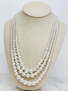 This classic multi-strand necklace is a must-have for any jewelry collection! 18"+3" Extender White Double Strand Layered Jewelry, Classic Multi-strand Jewelry, White Layered Double Strand Jewelry, Elegant Layered Long Necklace Jewelry, Elegant Layered White Jewelry, Classic Multi-strand Pearl White Necklaces, Classic Multi-strand Pearl White Necklace, Classic Pearl White Multi-strand Necklaces, White Elegant Multi-strand Layered Necklace