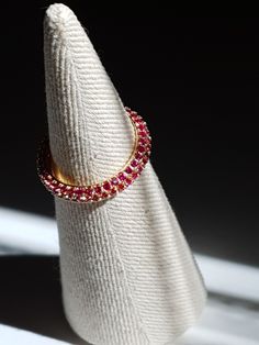 Ruby micro cz pave eternity ring  Material: 925 sterling silver, Ruby cz  Type: Pave eternity ring Size: US 6.5,7.5,8.5 Ruby with gold colour ring that has a classical luxury look, and the micro cz is easy for creating casual look.  Layering with mini eternity ring to complete your styling, it also goes well with plain gold vermeil ring.  High quality Ruby micro cz stone set on gold vermeil - gold plated on sterling silver ring  that has a stone on the side as a pave ring.  Korean jeweller made Ruby Ring Silver, Ruby Eternity Ring, Gold Ruby Ring, Silver Ruby Ring, Sterling Silver Cz Rings, Ruby Ring Gold, Gold Color Ring, Ring Ruby, Silver Engagement Ring