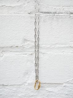 silver chain with gold carabiner charm hanging Metal Chain Necklace For Everyday Use, Everyday Chain Link Necklace With Carabiner Clasp, Everyday Chain Link Necklace With Lobster Clasp, Metal Charm Necklaces With Cable Chain, Metal Charm Necklaces With Cable Chain And Pendant, Everyday Metal Charm Necklace With Cable Chain, Everyday Oval Link Charm Necklace With Lobster Clasp, Everyday Oval Link Necklace With Carabiner Clasp, Everyday Metal Charm Necklace With Paperclip Chain