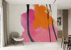 an abstract painting on the wall in a dining room