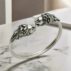 This handcrafted sterling silver cuff bracelet bangle features the Nemean Lion Motif from Ancient Greek Mythology. Being handmade it may have small differences Lion Head Bracelet, Nemean Lion, Ancient Greek Mythology, Two Heads, The Bangles, Greek Jewelry, Sterling Silver Cuff Bracelet, Sterling Silver Bangles, Bracelet Bangle